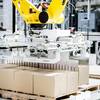 Robotic palletizer placing boxes on a pallet